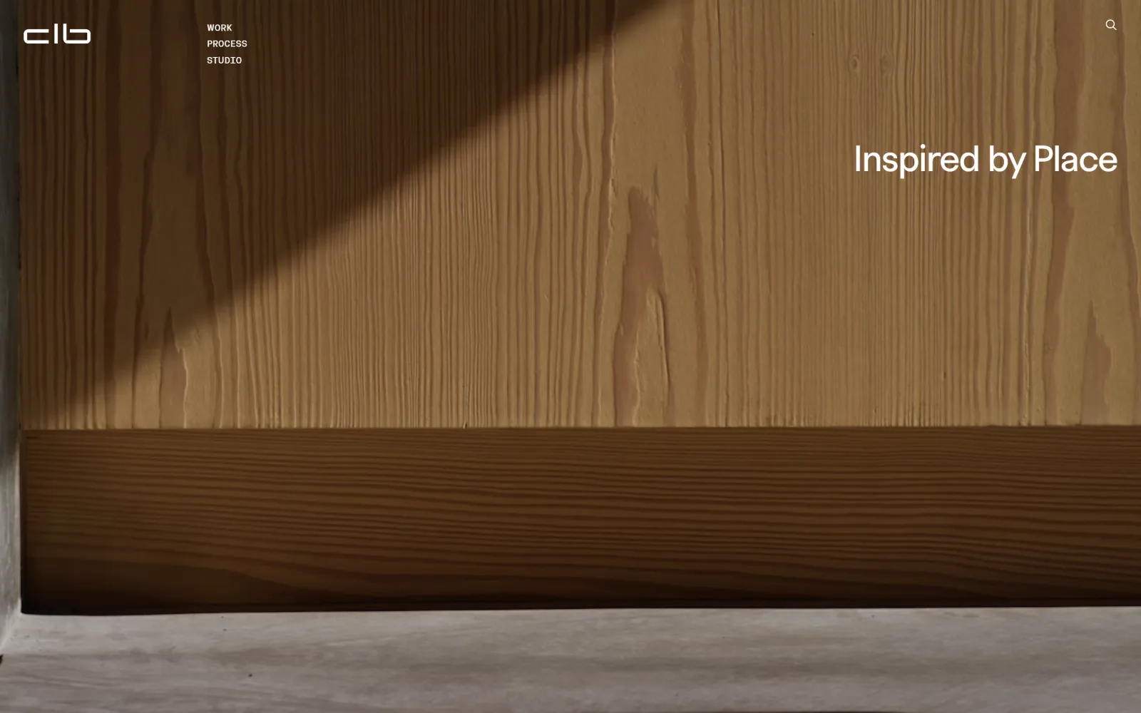 clbarchitects.com, architect website design: a close video still of sunlit vertical-grain timber boards fills the screen