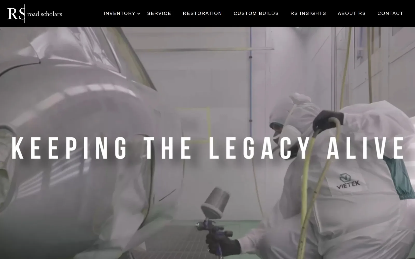 roadscholars.com, auto repair website design: two painters in full suits spraying a bare body