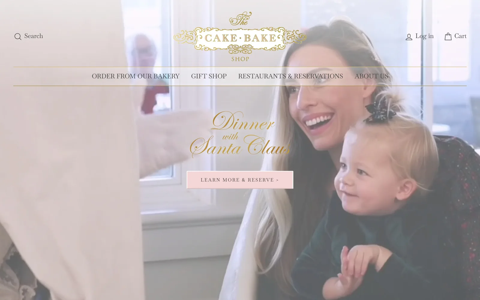 thecakebakeshop.com, bakery website design: a gold filigree crest and Spencerian script reading Dinner with Santa Claus sit over a bright