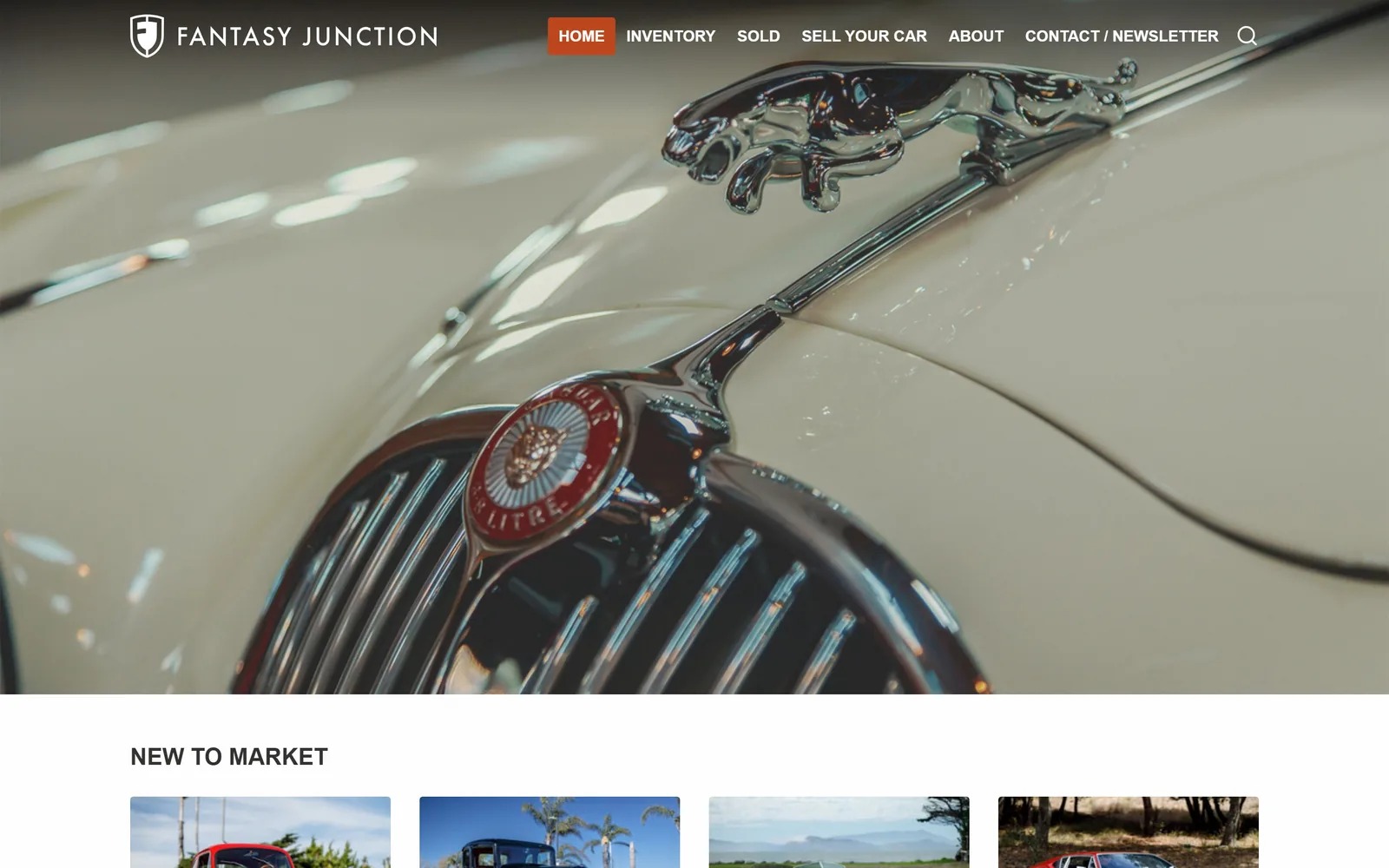 fantasyjunction.com, car dealership website design: a cream Jaguar Mk2 bonnet with the leaping cat mascot filling the frame