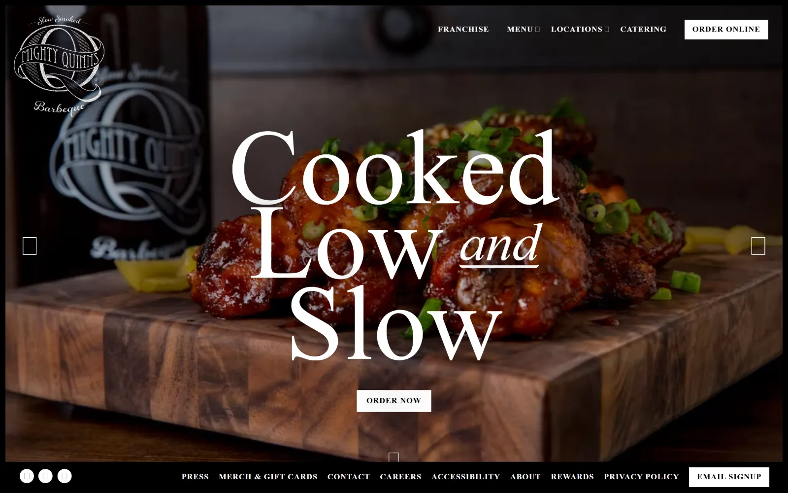 mightyquinnsbbq.com, catering website design: white script type at 194 pixels runs across a warmly lit board of glazed barbecue