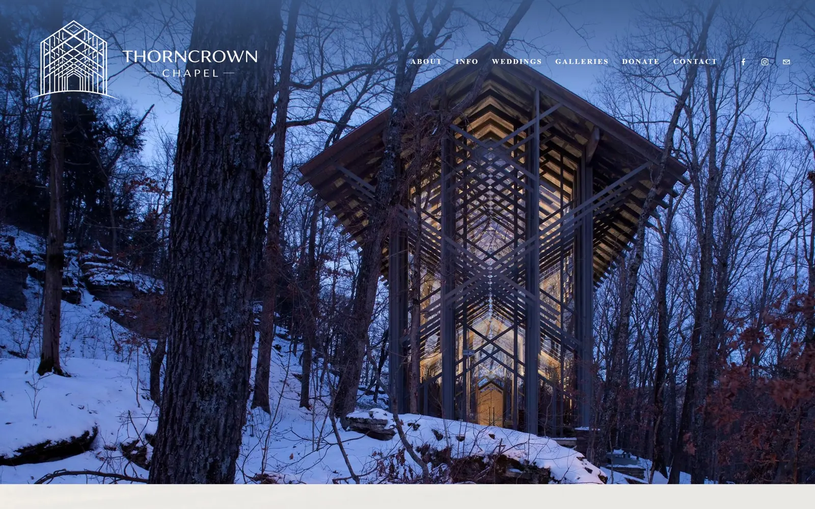 thorncrown.com, church website design: a glass and timber chapel glows gold in blue winter woods