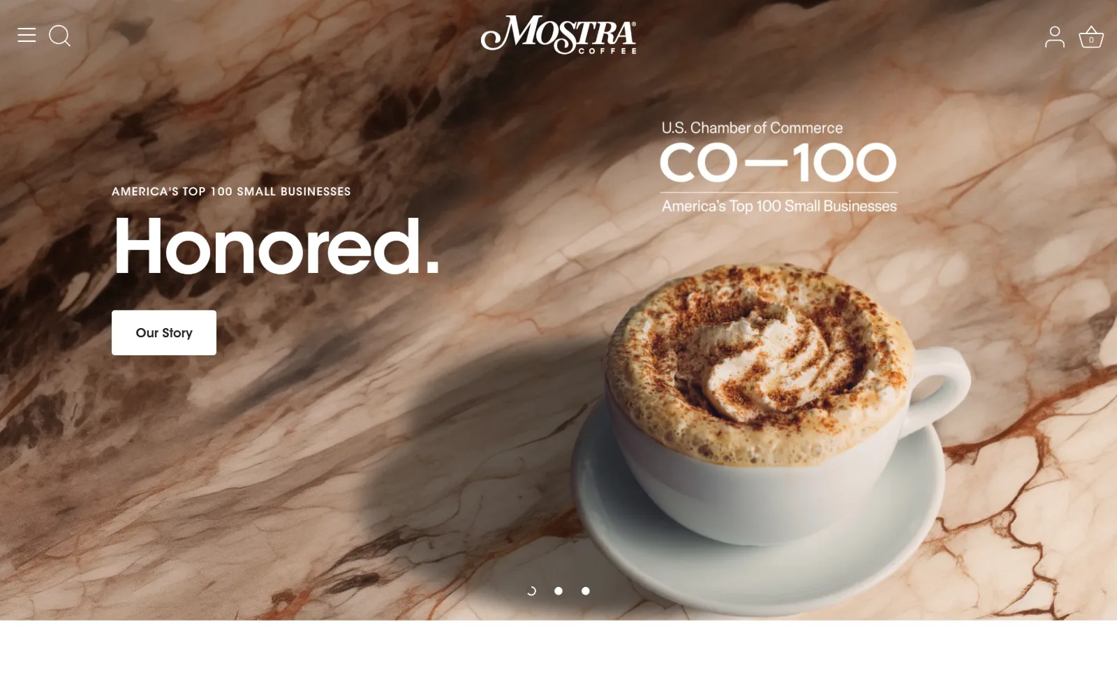 mostracoffee.com, coffee shop website design: brown-veined marble fills the frame behind the word Honored set very large