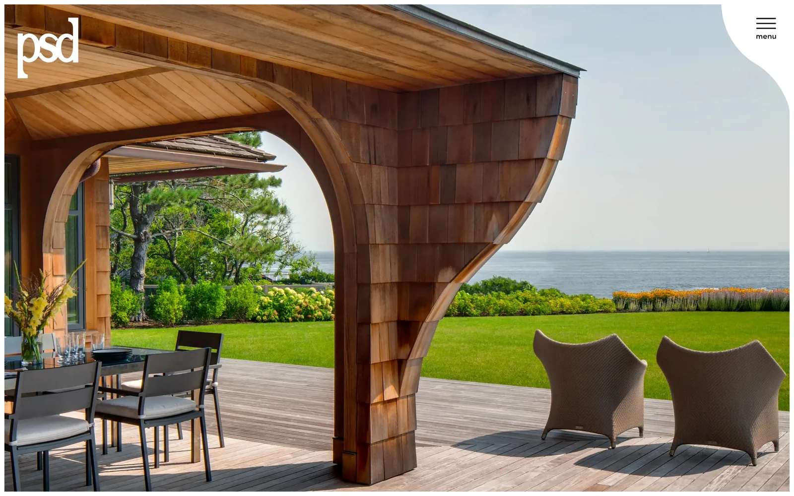 psdab.com, construction website design: one photograph of a curved cedar shingle canopy over the sea, and almost nothing else on the screen