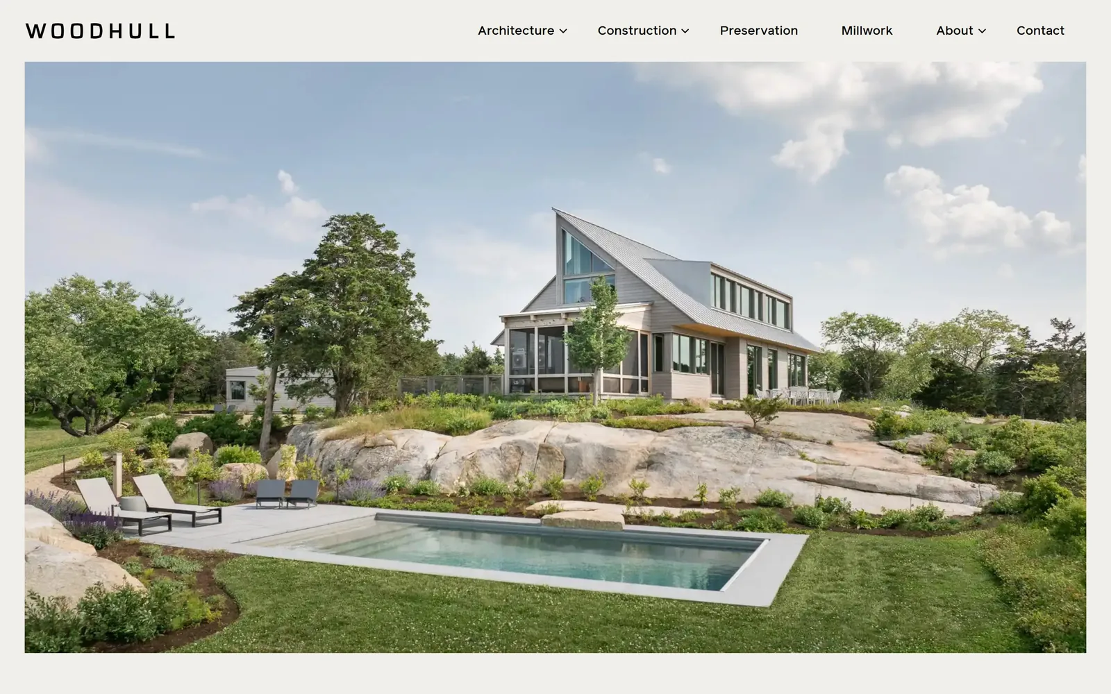 woodhullmaine.com, construction website design: wOODHULL spaced wide across the top, then a single house on granite ledge with a pool