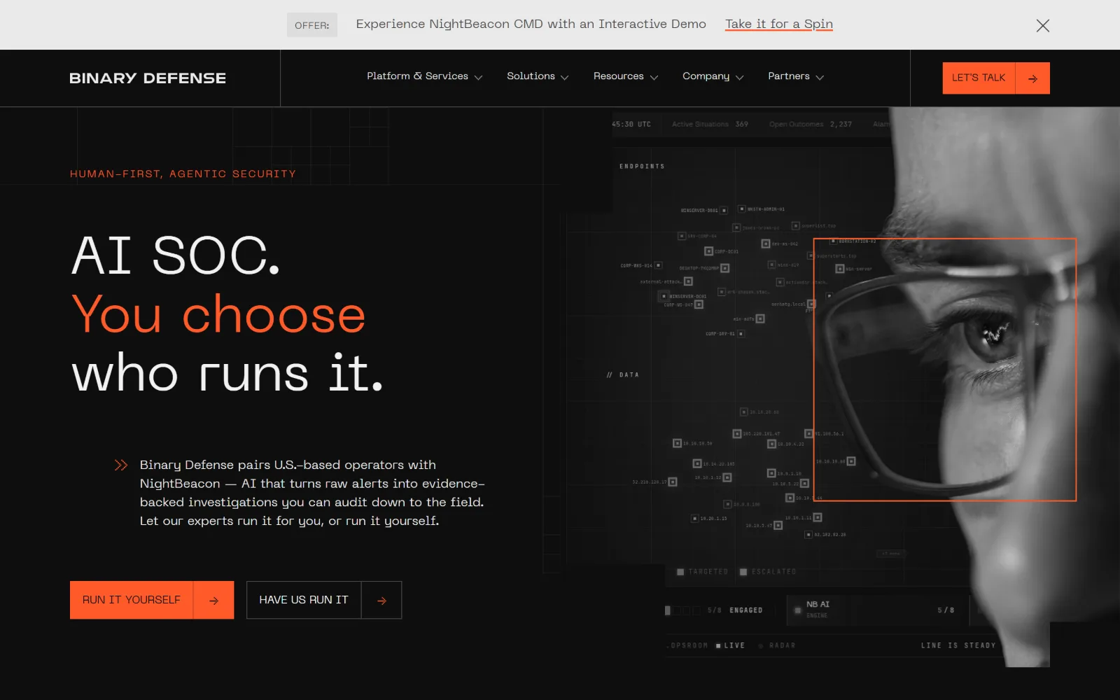 binarydefense.com, cyber security website design: orange 'You choose' splits a three-line white headline on near-black