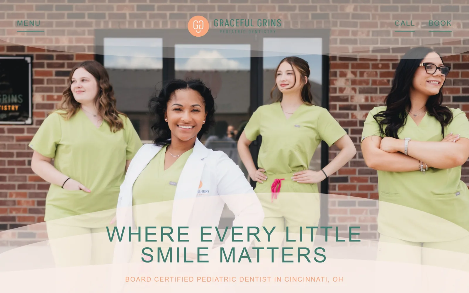 gracefulgrinspd.com, dental website design: four staff in lime scrubs outside their brick storefront