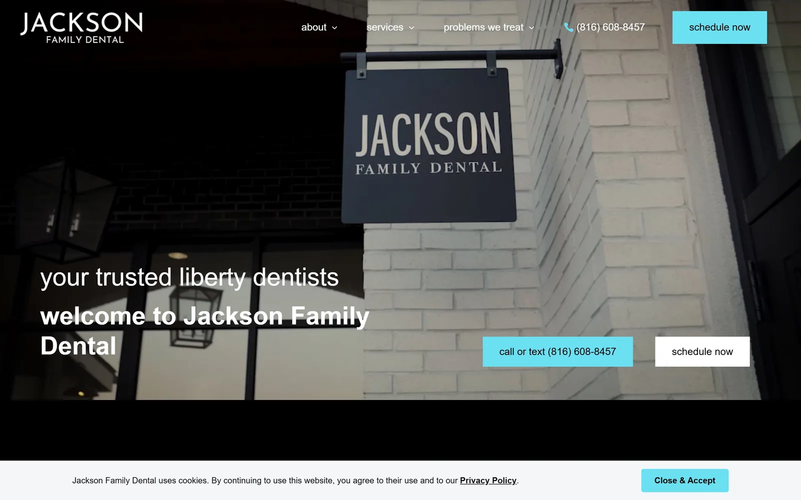 jacksonfamilydentalonline.com, dental website design: video of the practice's own hanging sign on white brick