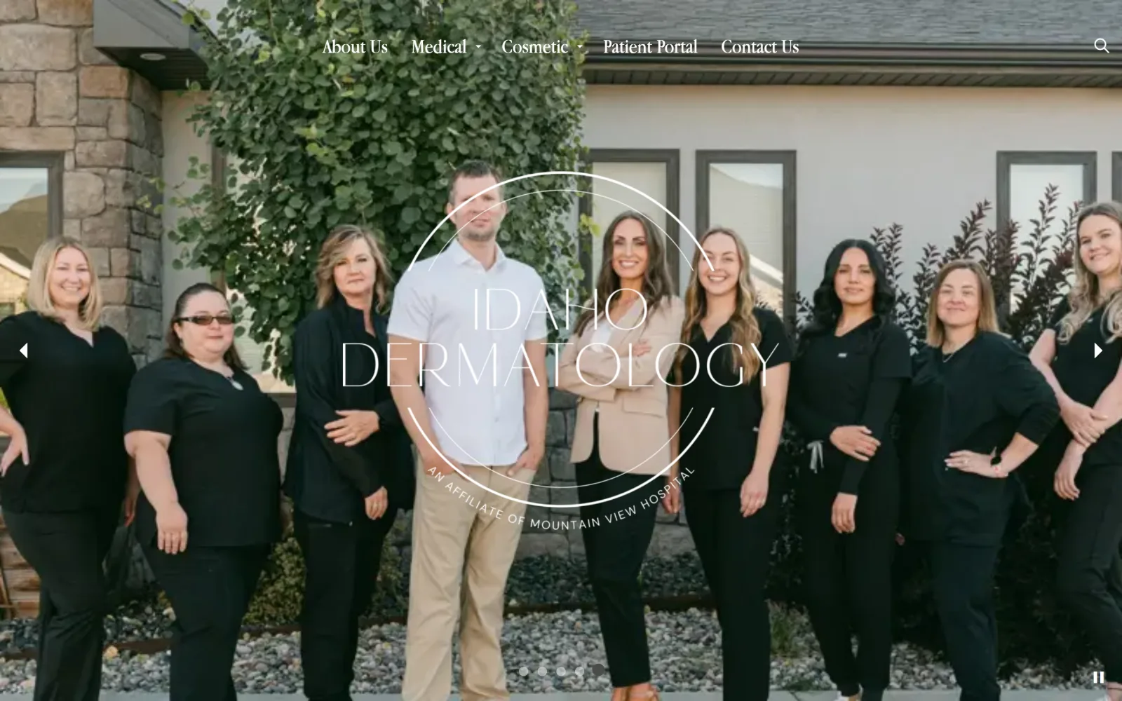 idahodermatology.com, dermatology website design: nine staff members in black scrubs stand outside a stone and stucco clinic