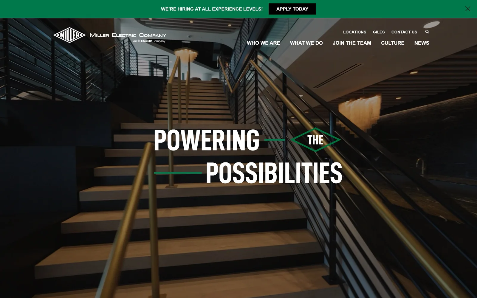 mecojax.com, electrician website design: condensed white capitals broken across two lines by a green diamond holding the word