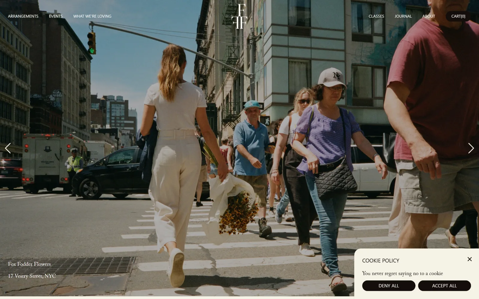 foxfodderflowers.com, florist website design: a documentary street shot of a woman crossing a Manhattan intersection with marigolds