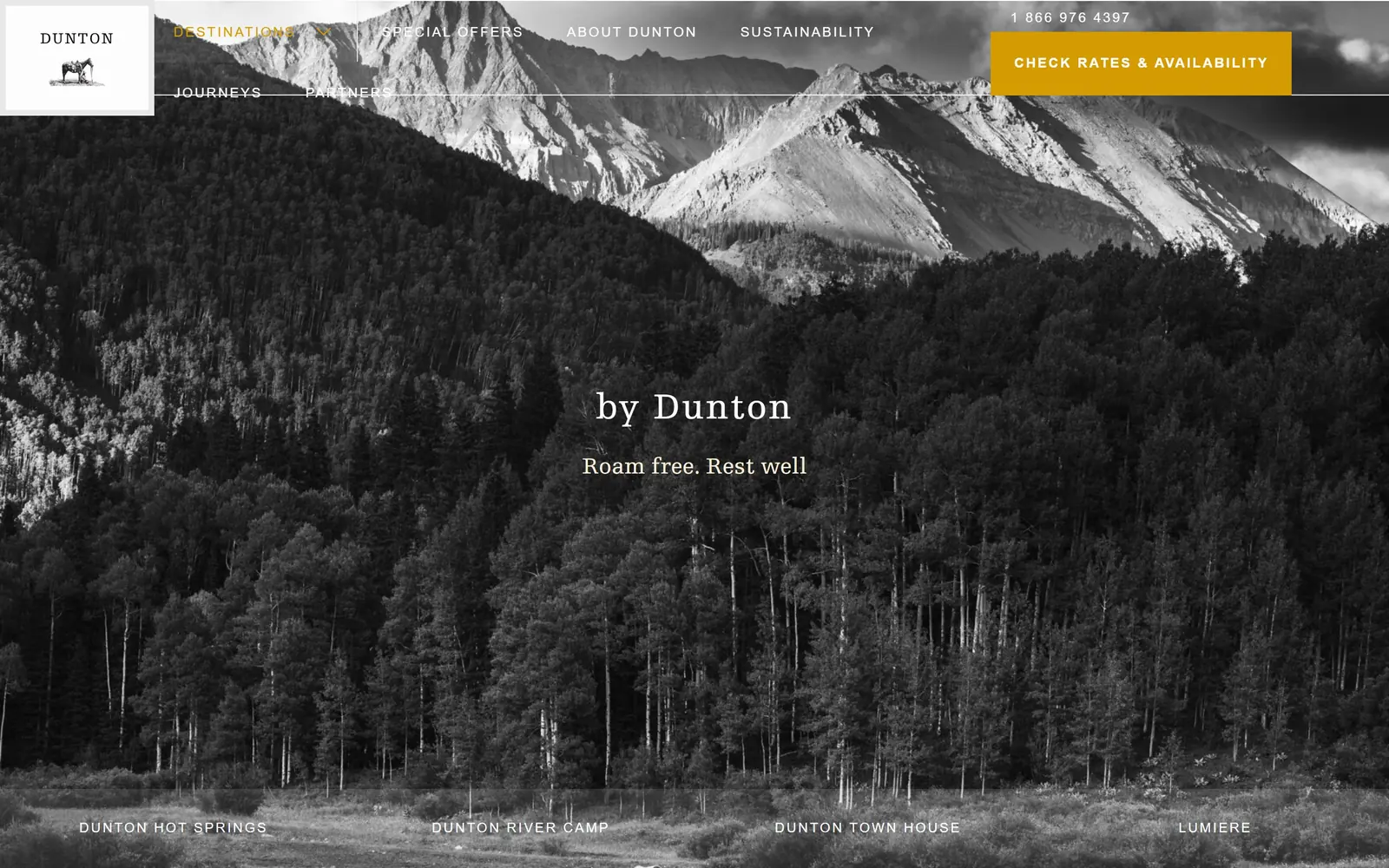 duntondestinations.com, hotel website design: a black and white Colorado valley, aspen forest below bare peaks