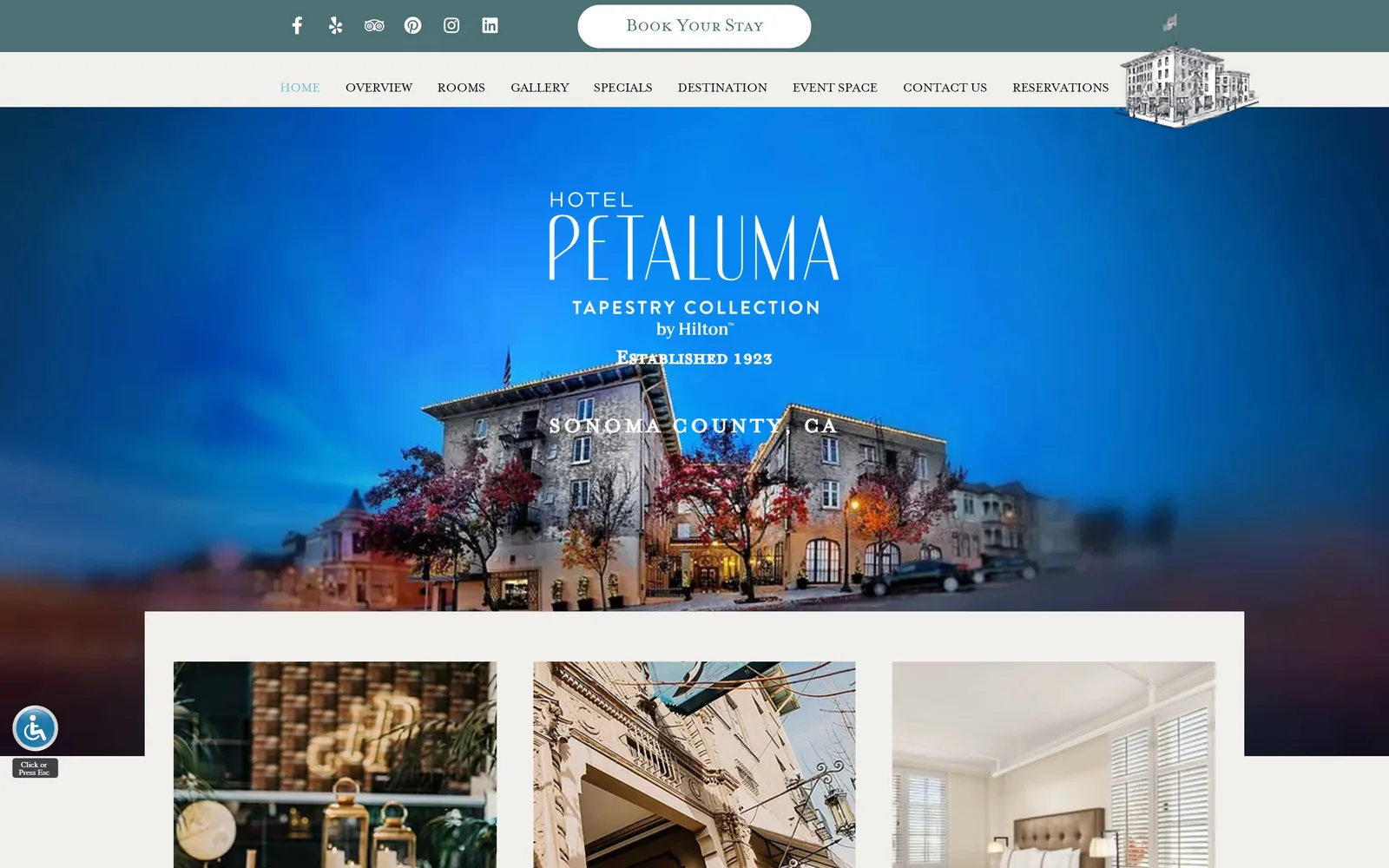 hotelpetaluma.com, hotel website design: a 1923 stone hotel at blue hour under a stacked white wordmark
