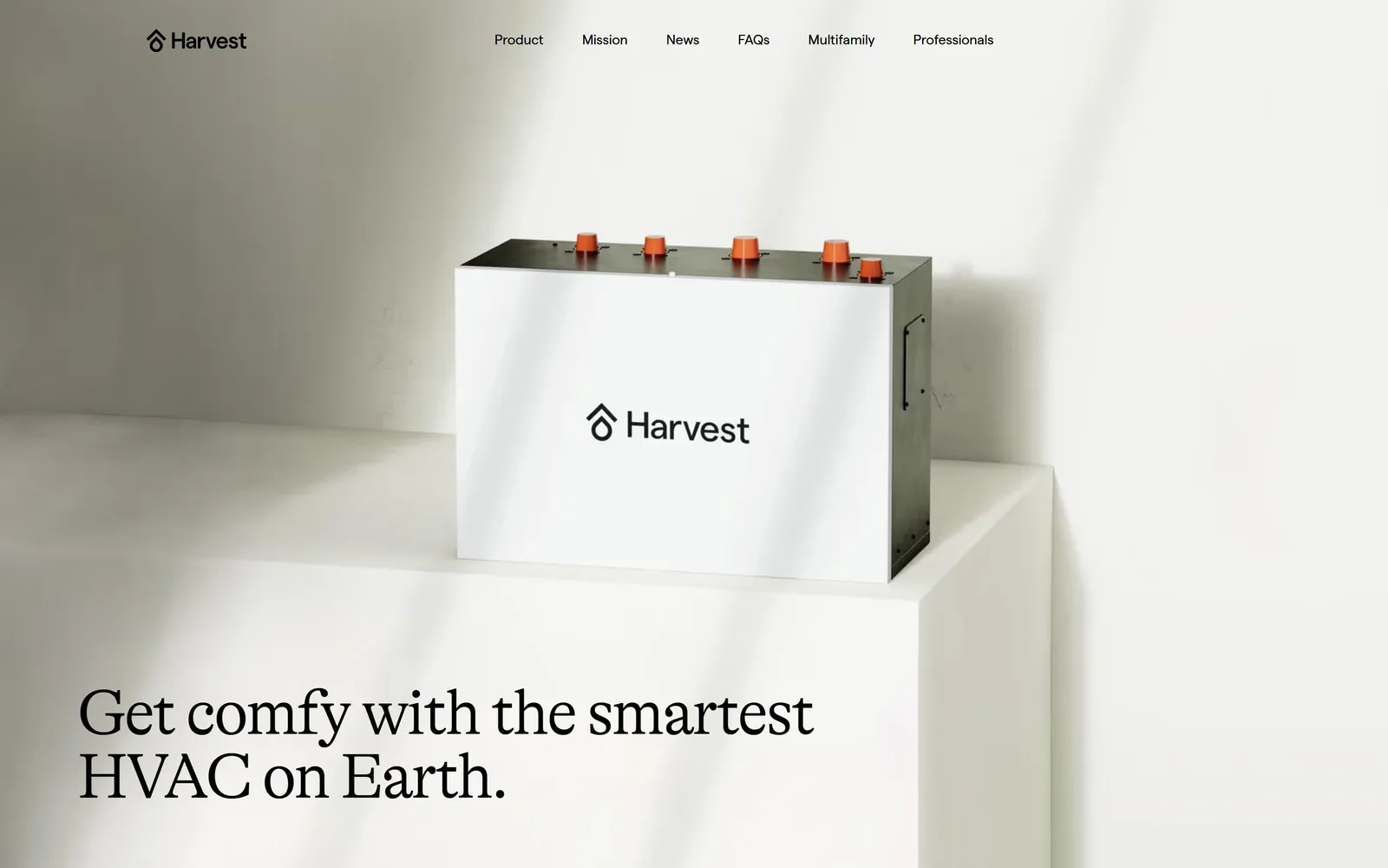 harvest-thermal.com, hvac website design: a white thermal battery with orange ports stands on a plinth in raking daylight