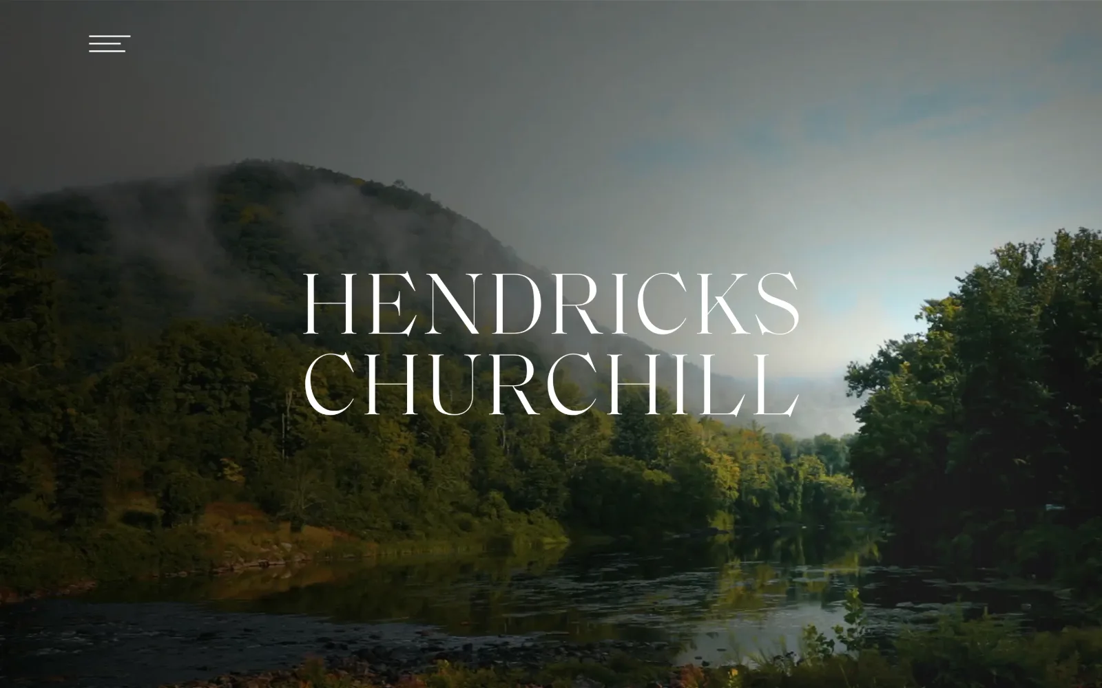 hendrickschurchill.com, interior design website design: a misted river valley plays behind the studio name set in 100px didone capitals