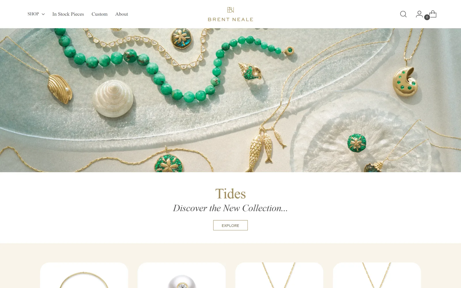 brentneale.com, jewelry store website design: green chrysoprase beads and gold charms lie on a frosted glass dish