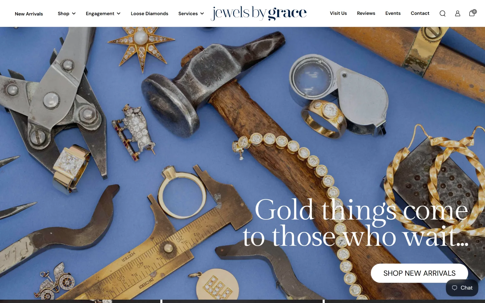 jewelsbygrace.com, jewelry store website design: bench tools, calipers and a hammer lie on cornflower blue paper scattered with antique