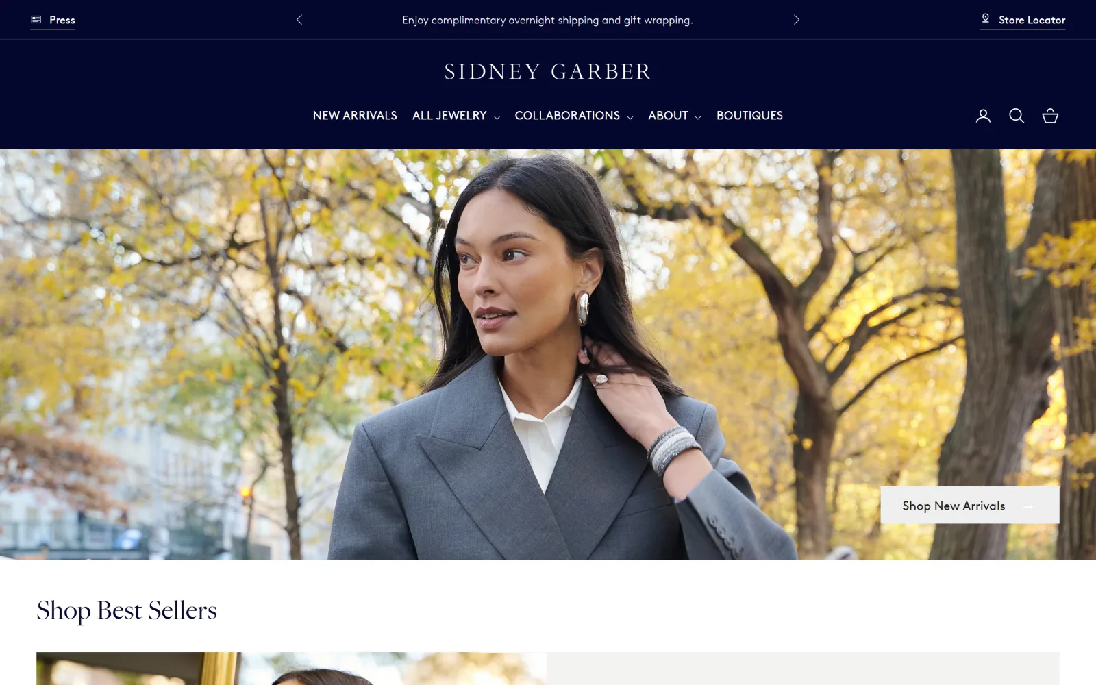 sidneygarber.com, jewelry store website design: deep navy header with a centred wordmark above an autumn street portrait