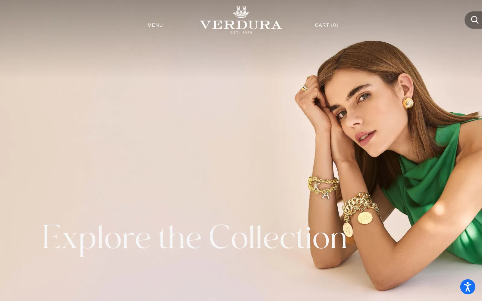 verdura.com, jewelry store website design: emerald silk, charm bracelets and a gold earring on a model resting on her hands