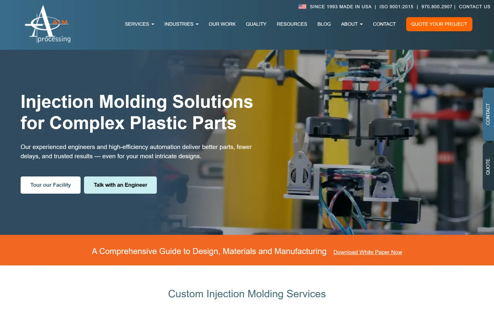aimprocessing.com, manufacturing website design: slate-blue wash over a robot arm lifting moulded parts, with a white headline