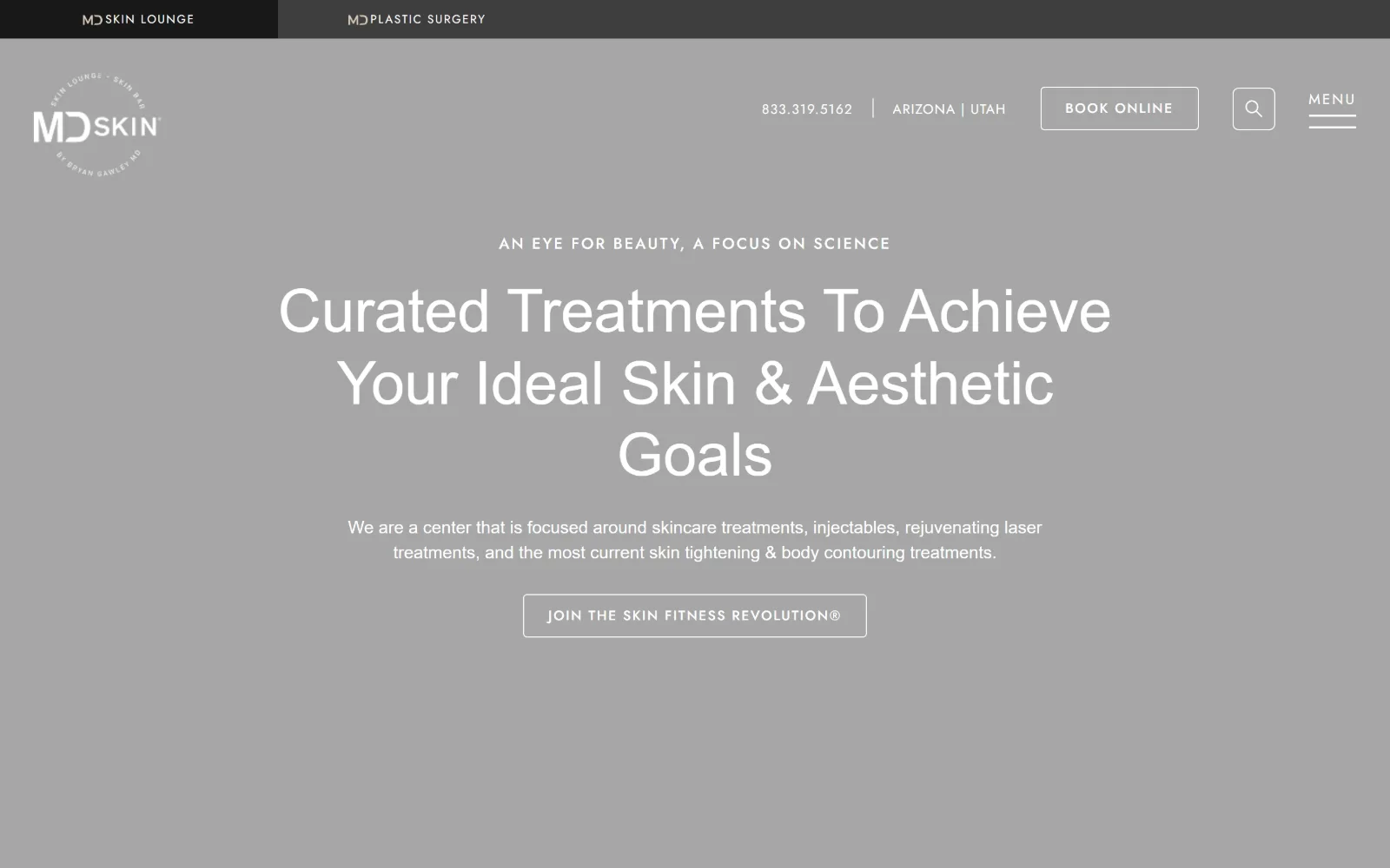 mdskinlounge.com, med spa website design: flat mid-grey carries centred white type, a three-line headline and an outlined button