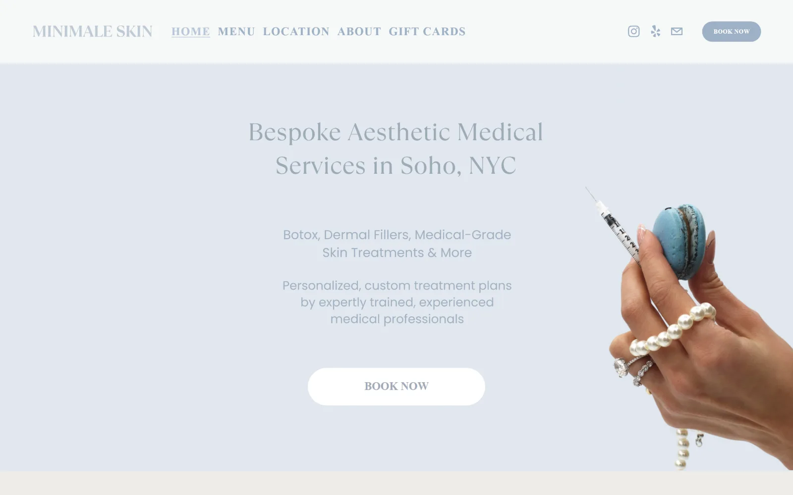 minimaleskin.com, med spa website design: pale blue-grey fills the screen behind centred grey copy and a white pill button