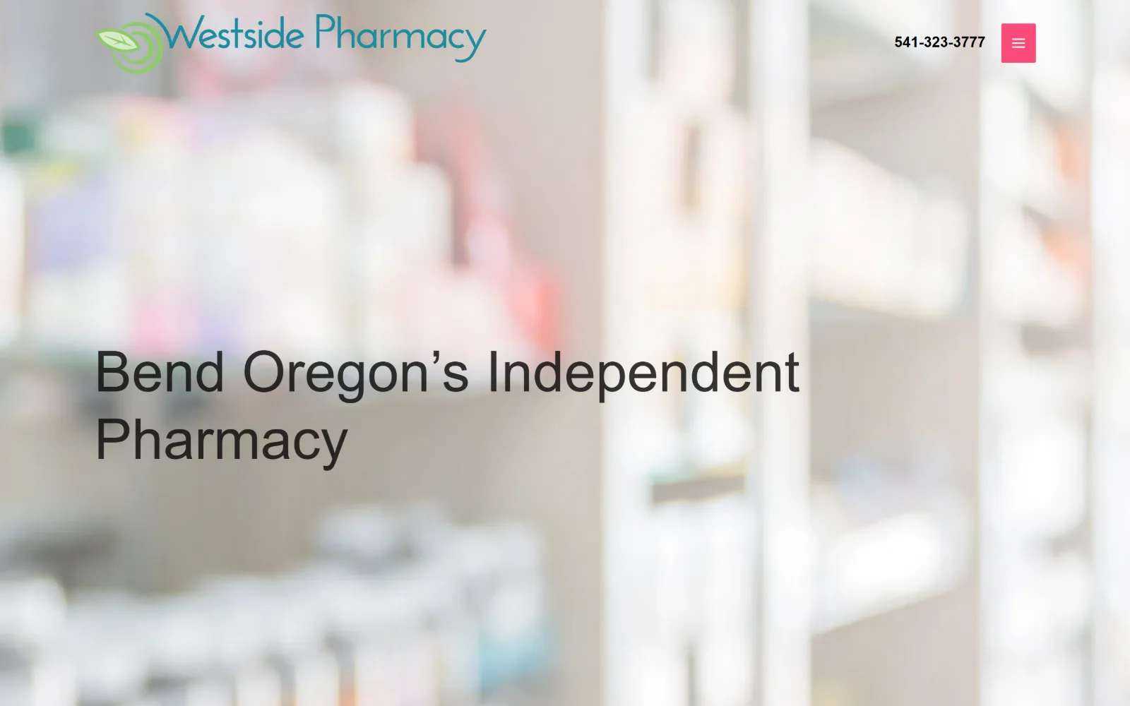 westsidebendrx.com, pharmacy website design: heavily blurred shelf photography fills the frame behind a two line grey headline