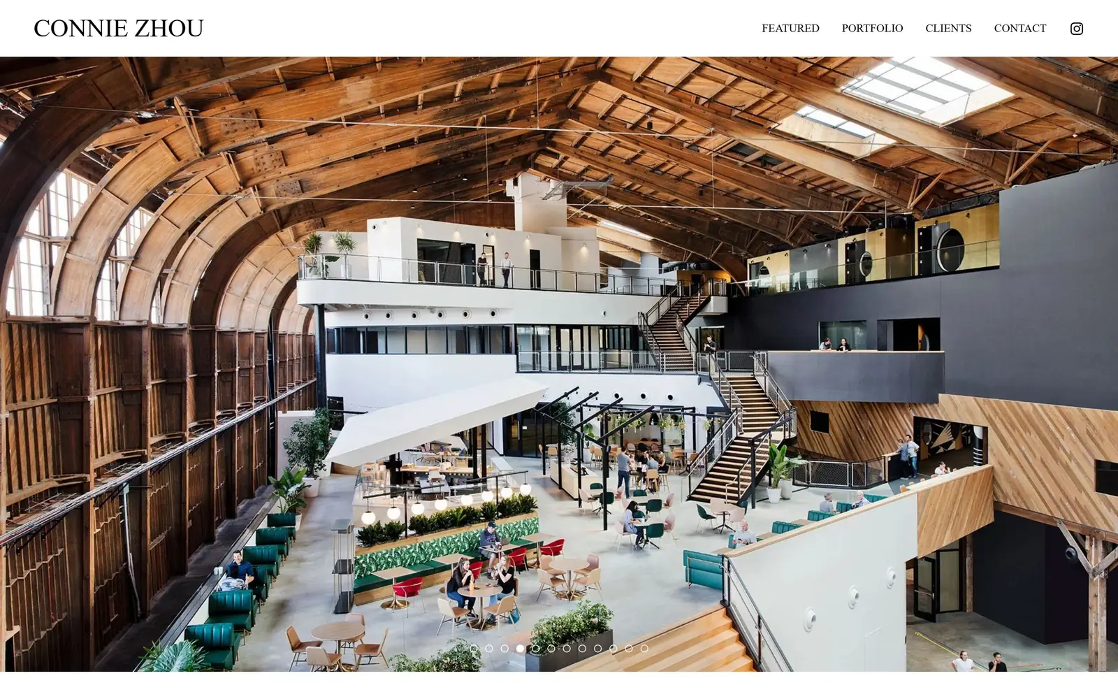 conniezhou.com, photography website design: a wide-angle interior of a barrel-vaulted timber hangar fills the screen beneath a thin white