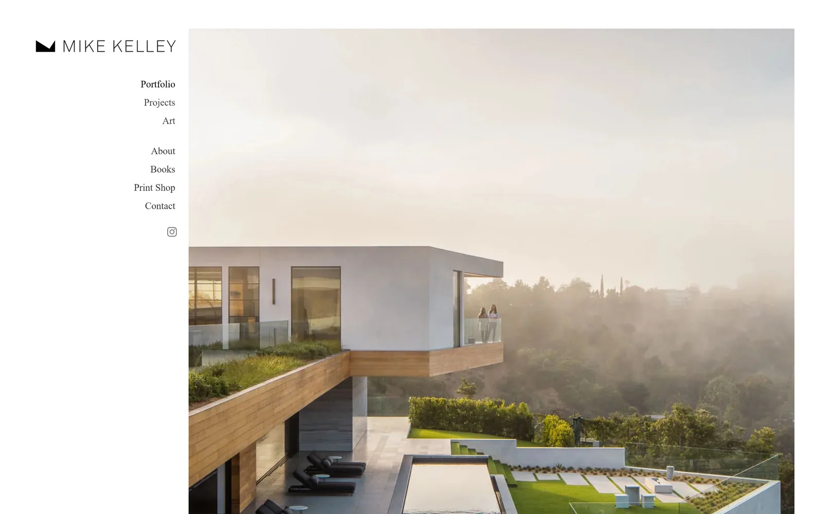 mpkelley.com, photography website design: a hillside house in morning haze sits right of a narrow white column holding a black mountain