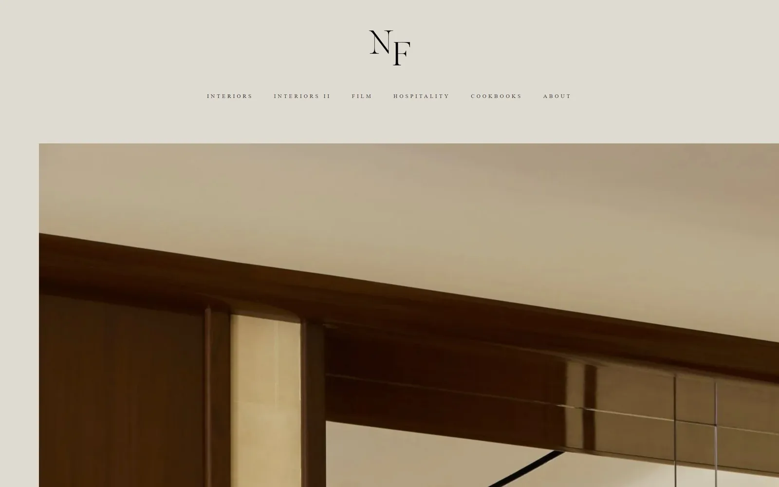 nicolefranzen.com, photography website design: an NF serif monogram above a widely tracked nav on warm grey