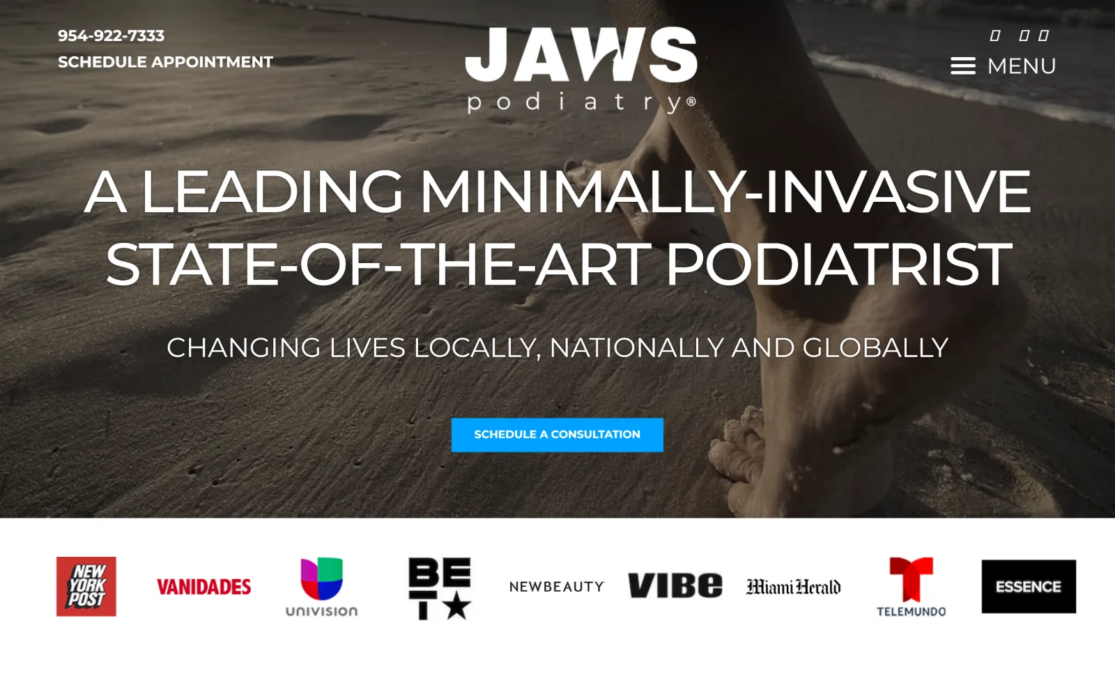 jawspodiatry.com, podiatry website design: a dark beach photograph of a bare foot in wet sand sits under a wide uppercase headline