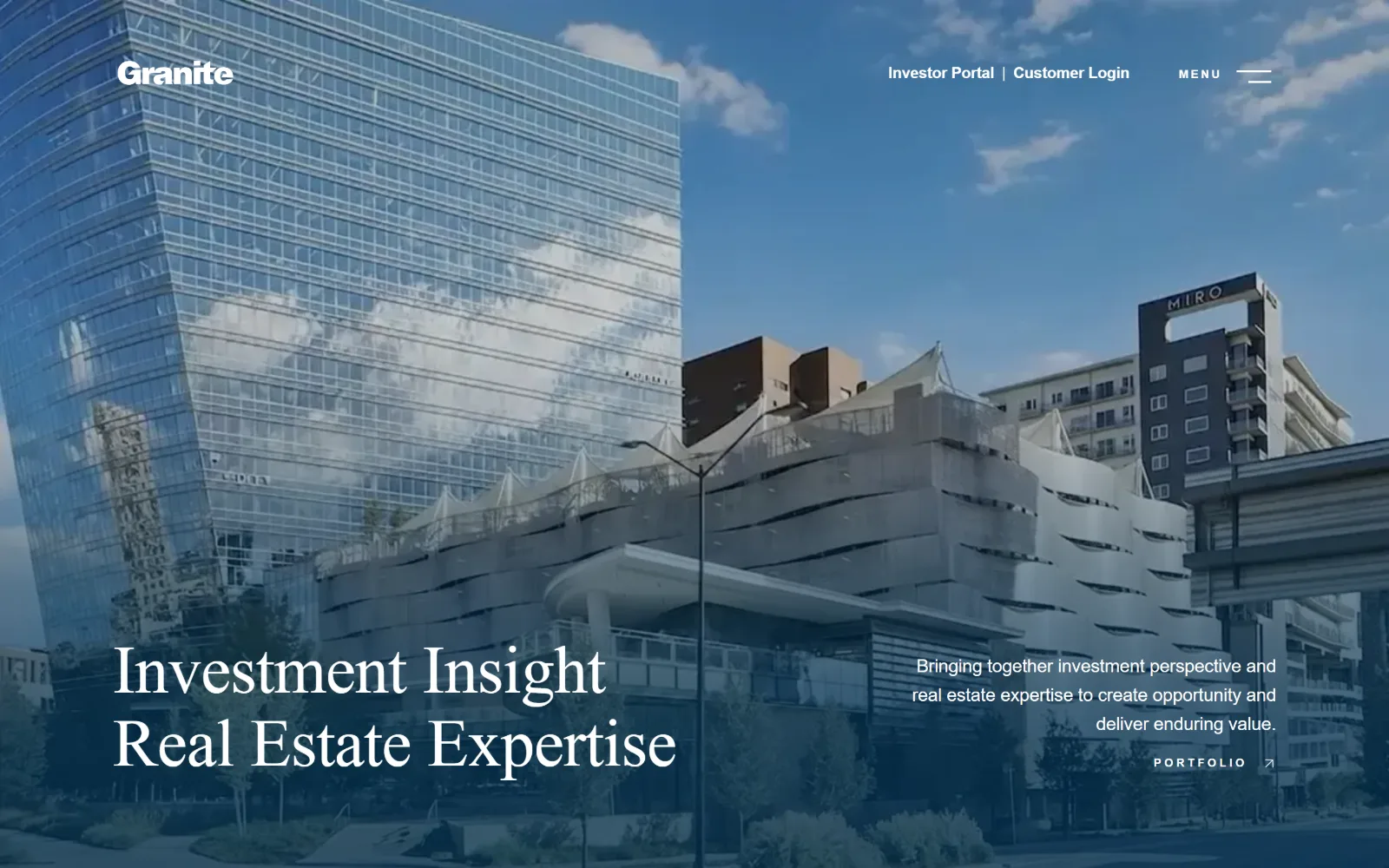 graniteprop.com, property management website design: a glass tower under blue sky sits beneath a heavy blue wash