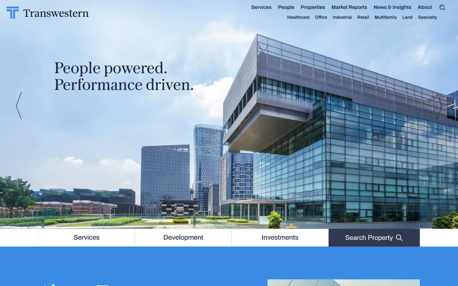 transwestern.com, property management website design: a cantilevered glass office block under bright cloud sits behind a two-line serif