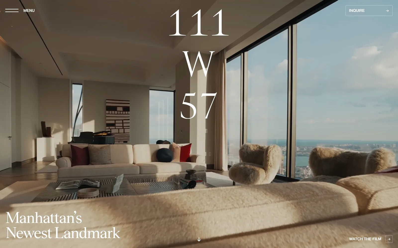 111w57.com, real estate website design: a high-contrast serif stacks 111 W 57 down the centre of a sunlit penthouse interior shot on video