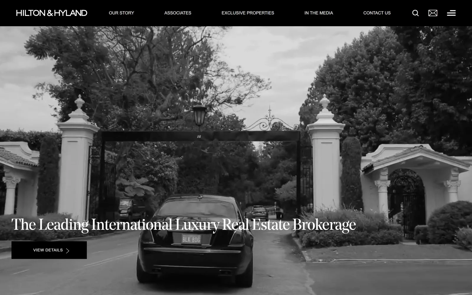 hiltonhyland.com, real estate website design: black and white footage of a car at an estate gate, a serif line across the lower third