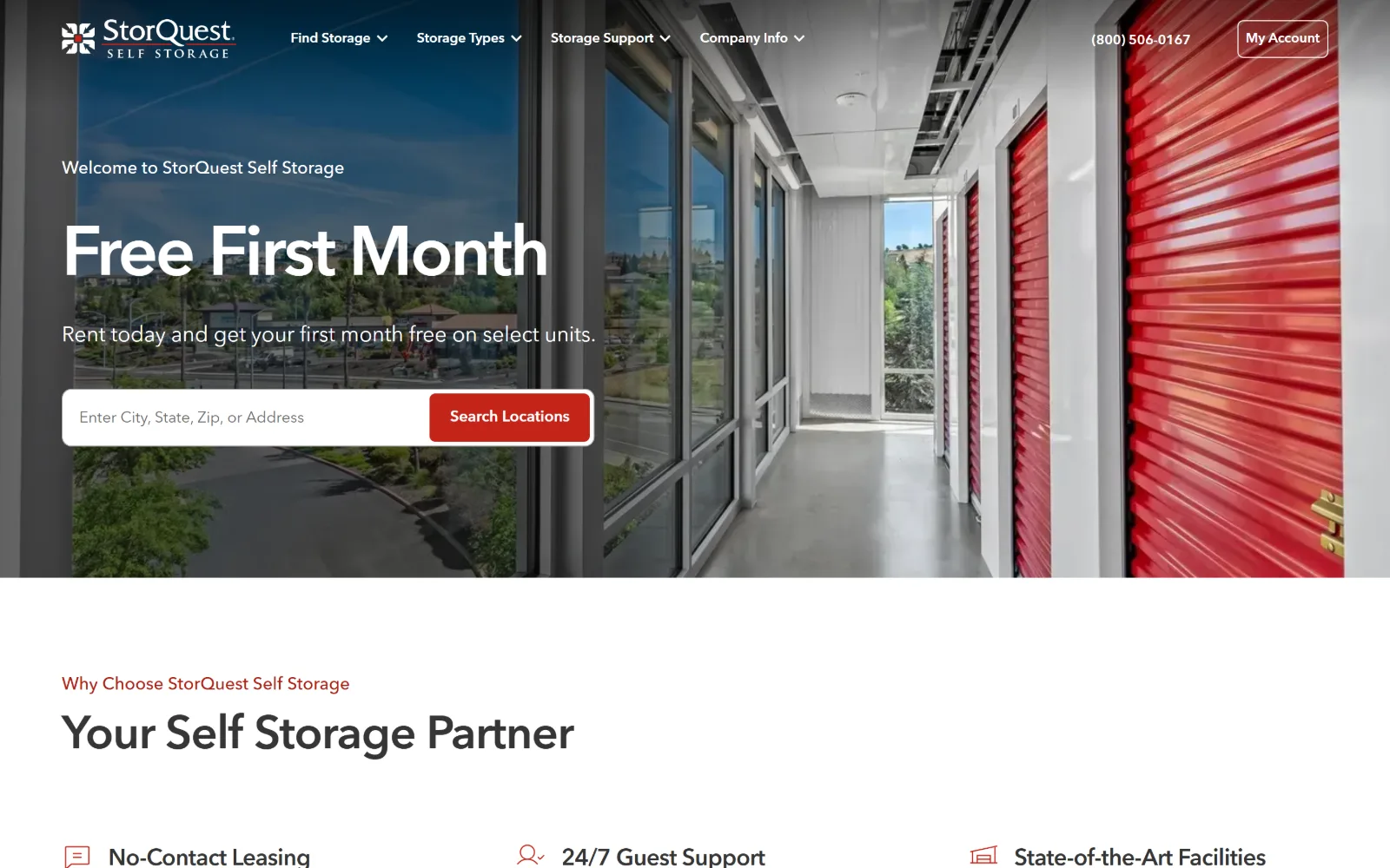 storquest.com, self storage website design: wide shot down a glazed corridor lined with red roller doors, with a white headline