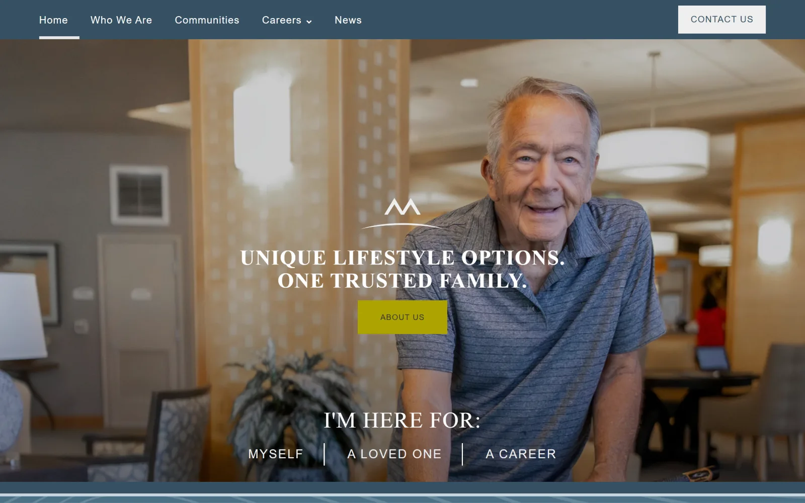 merrillgardens.com, senior living website design: a smiling man in a striped polo leans on a lobby counter behind a slate blue nav bar