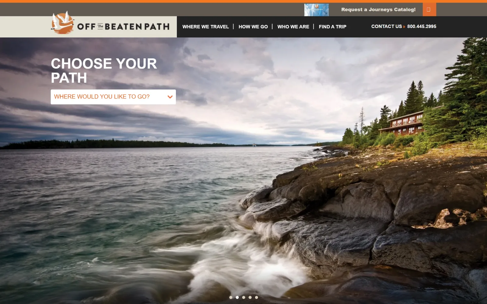 offthebeatenpath.com, travel agency website design: a long exposure of waves breaking on rock below a lodge in pines