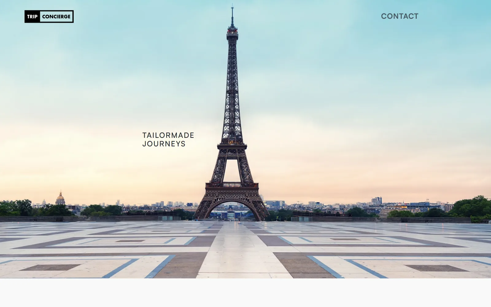 tripconcierge.co, travel agency website design: the Eiffel Tower stands centred at dawn above the empty paved terrace of the Trocadero