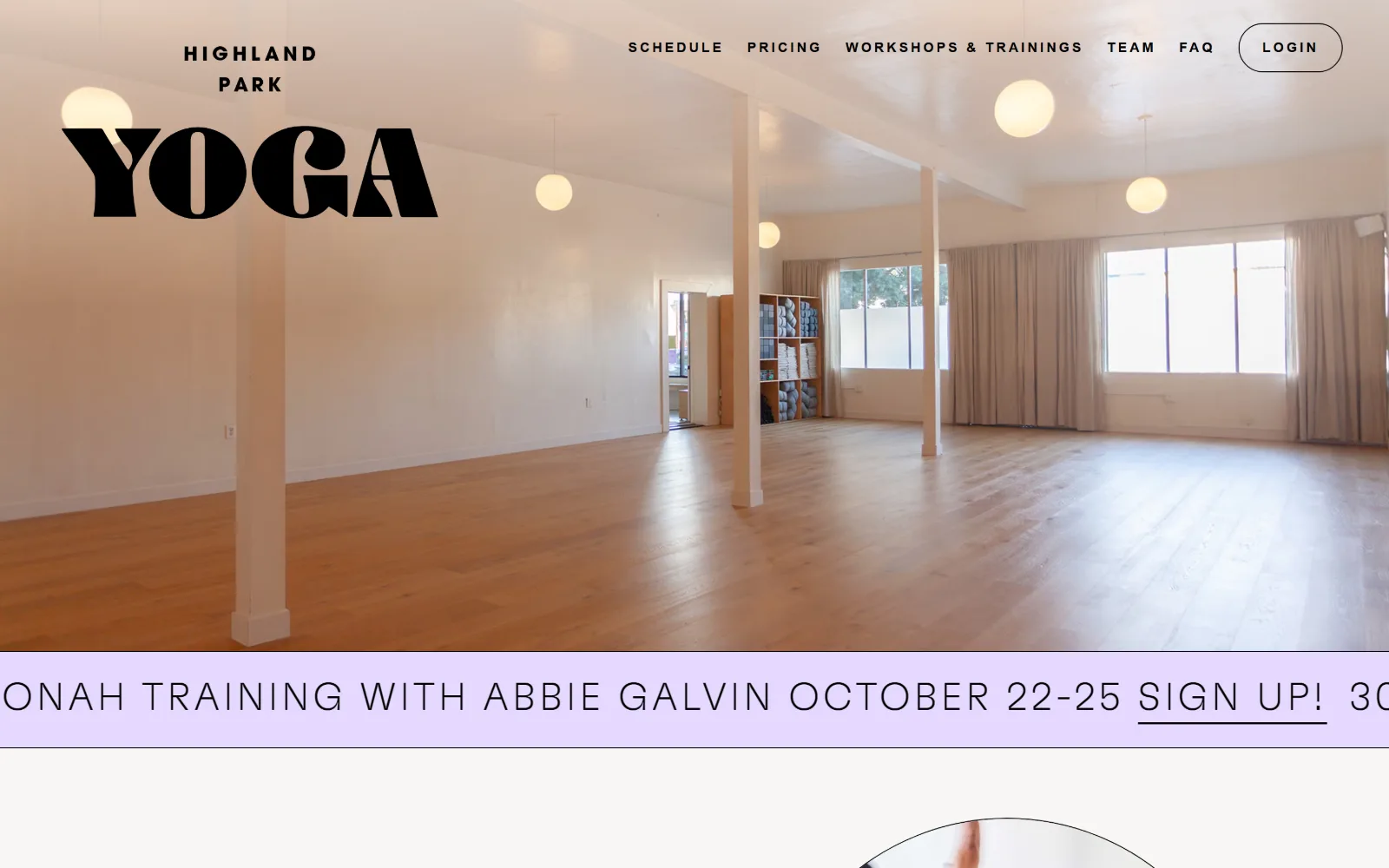 highlandparkyoga.com, yoga studio website design: an empty studio with pale pink columns